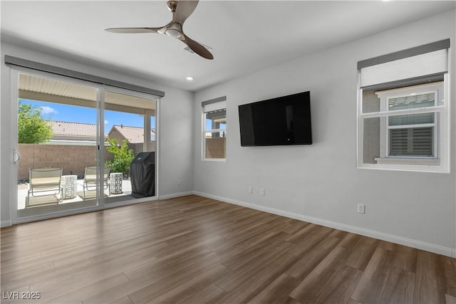 5936 Bruselas St, Las Vegas, NV 89113 - unfurnished living room featuring ceiling fan, wood finished floors, and recessed lighting
