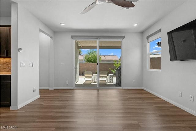 5936 Bruselas St, Las Vegas, NV 89113 - empty room featuring wood finished floors, ceiling fan, and recessed lighting