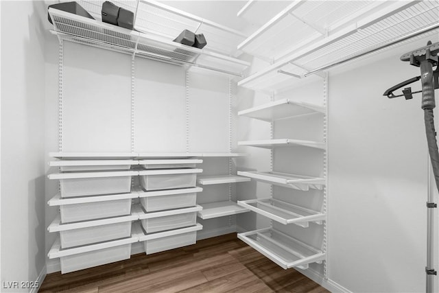 5936 Bruselas St, Las Vegas, NV 89113 - walk in closet featuring wood finished floors