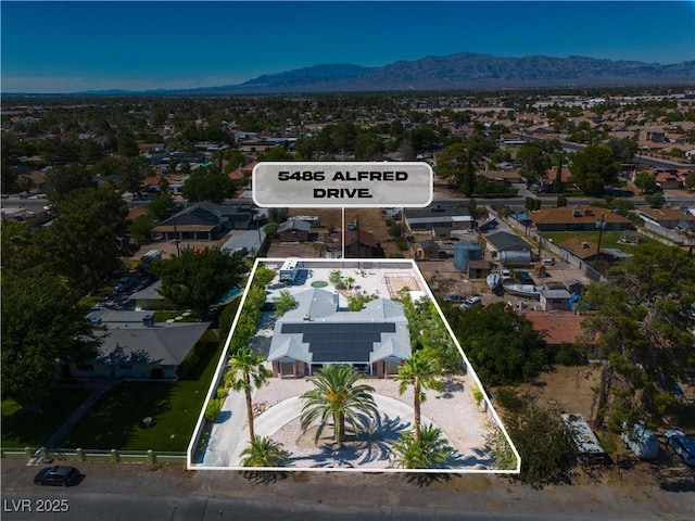 5486 Alfred Dr, Las Vegas, NV 89108 - aerial overview of property's location featuring mountains, property boundaries highlighted, and nearby suburban area
