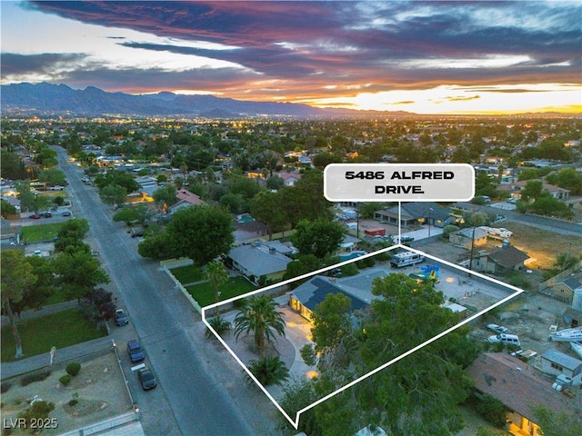 5486 Alfred Dr, Las Vegas, NV 89108 - aerial view at dusk of a mountain view and property boundaries highlighted