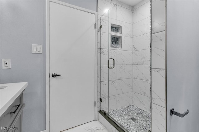 5486 Alfred Dr, Las Vegas, NV 89108 - bathroom with marble look tiles, a stall shower, and vanity