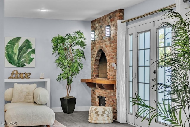 5486 Alfred Dr, Las Vegas, NV 89108 - living area featuring a brick fireplace and wood finished floors