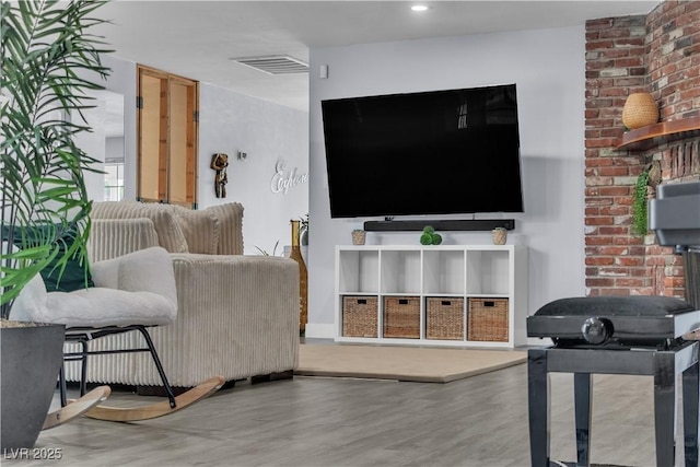 5486 Alfred Dr, Las Vegas, NV 89108 - living room featuring wood finished floors and a wood stove