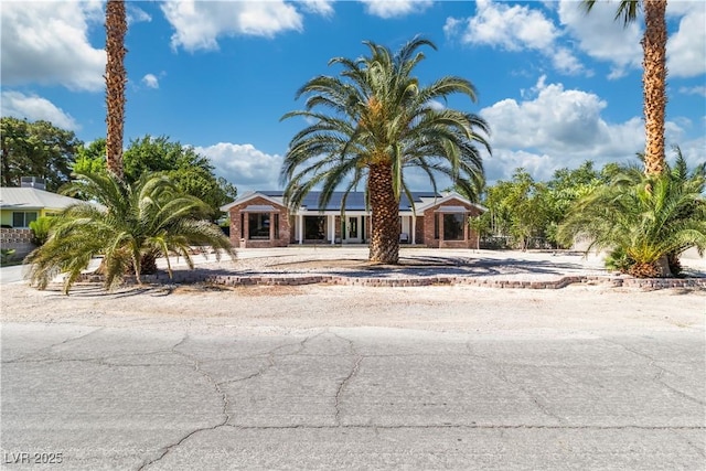 5486 Alfred Dr, Las Vegas, NV 89108 - obstructed view of property with roof mounted solar panels