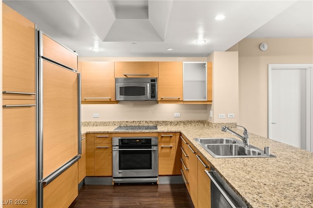 222 Karen Ave Unit 1702, Las Vegas, NV 89109 - kitchen featuring stainless steel appliances, dark wood-style floors, light stone countertops, recessed lighting, and a peninsula