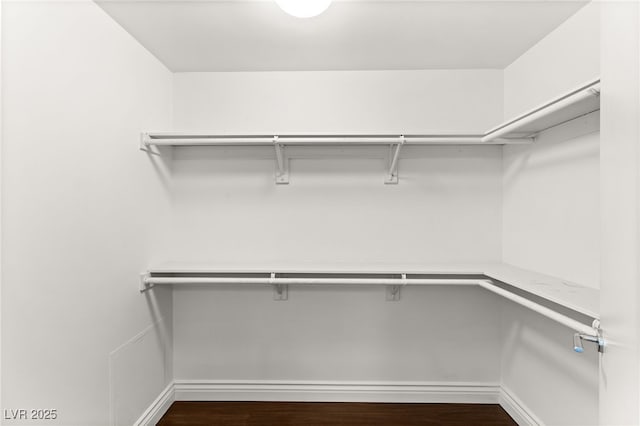 222 Karen Ave Unit 1702, Las Vegas, NV 89109 - spacious closet with dark wood-style flooring