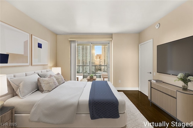 222 Karen Ave Unit 1702, Las Vegas, NV 89109 - bedroom with dark wood-style floors and access to outside