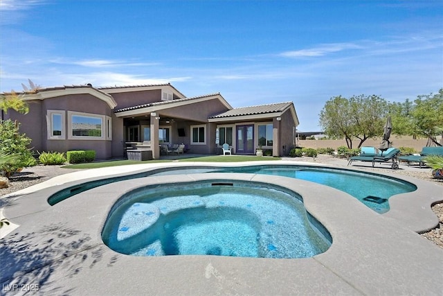 6208 W Rome Blvd, Las Vegas, NV 89131 - rear view of house featuring an in-ground hot tub, a patio, an outdoor pool, stucco siding, and a tile roof