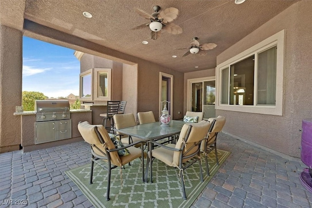 6208 W Rome Blvd, Las Vegas, NV 89131 - view of patio with an outdoor kitchen, outdoor dining space, and ceiling fan