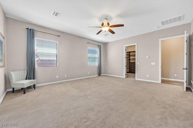 6208 W Rome Blvd, Las Vegas, NV 89131 - unfurnished bedroom with light carpet, a walk in closet, and ceiling fan