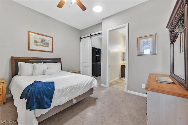 6208 W Rome Blvd, Las Vegas, NV 89131 - bedroom featuring a barn door, light carpet, ensuite bath, and ceiling fan