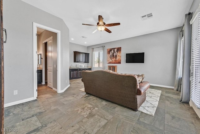 6208 W Rome Blvd, Las Vegas, NV 89131 - living area featuring ceiling fan, stone finish flooring, and recessed lighting