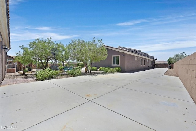6208 W Rome Blvd, Las Vegas, NV 89131 - view of home's exterior featuring stucco siding and a patio