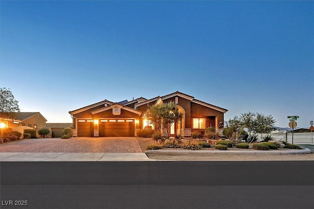 6208 W Rome Blvd, Las Vegas, NV 89131 - ranch-style house with decorative driveway, an attached garage, and stucco siding