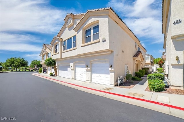 2558 Lazy Saddle Dr, Henderson, NV 89002 - view of asphalt road featuring curbs, sidewalks, and a residential view