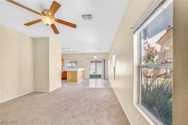 2558 Lazy Saddle Dr, Henderson, NV 89002 - unfurnished living room featuring light colored carpet and ceiling fan