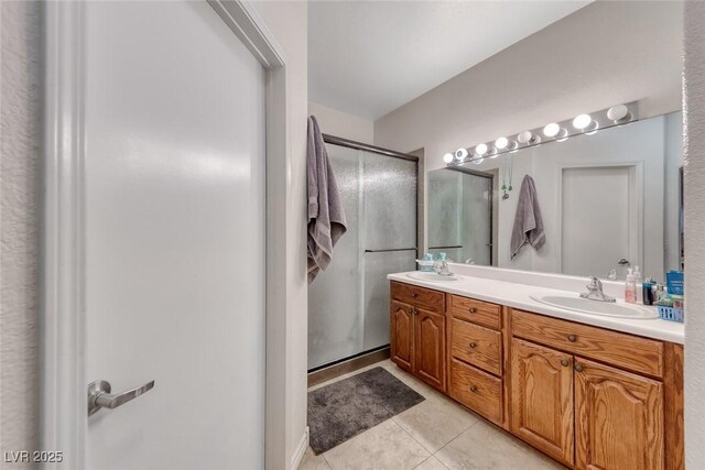 105 Lighthouse Dr Unit 105, Boulder City, NV 89005 - bathroom featuring double vanity, tile patterned flooring, and a stall shower