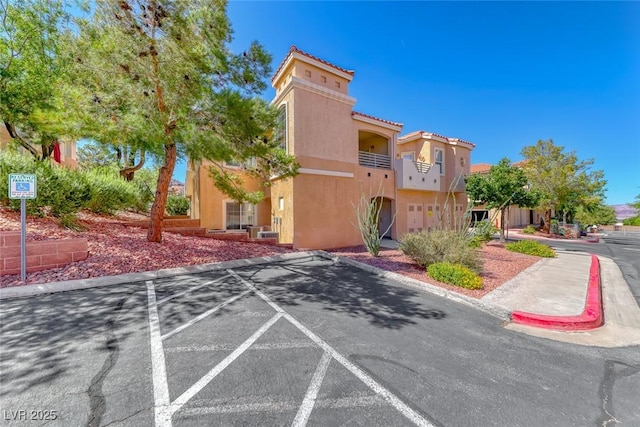 105 Lighthouse Dr Unit 105, Boulder City, NV 89005 - view of building exterior featuring uncovered parking