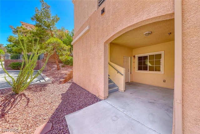 105 Lighthouse Dr Unit 105, Boulder City, NV 89005 - doorway to property featuring stucco siding and a patio