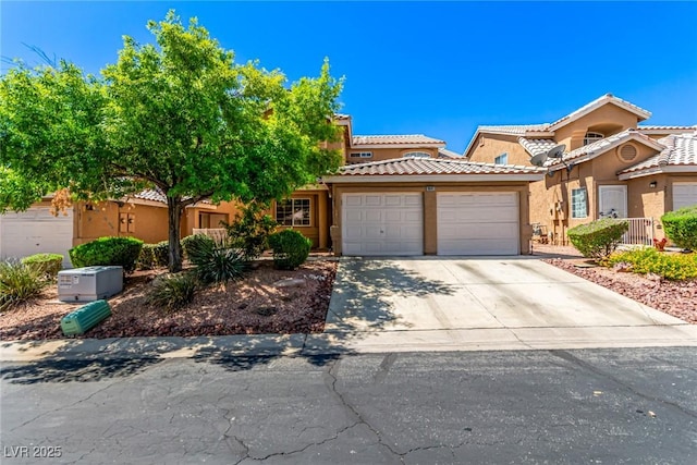 8041 Astrology Ct Unit 201, Las Vegas, NV 89128 - view of front of home featuring a garage, stucco siding, driveway, and a tiled roof