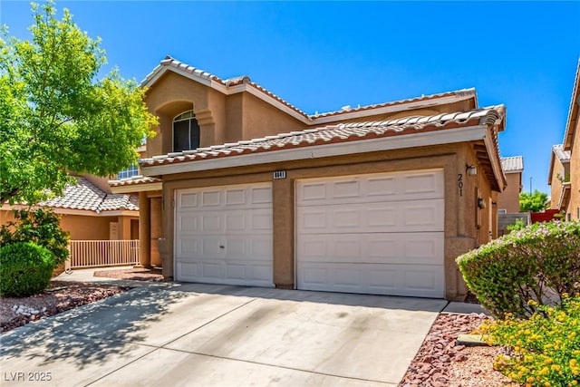 8041 Astrology Ct Unit 201, Las Vegas, NV 89128 - view of front of home with concrete driveway, stucco siding, and a tile roof