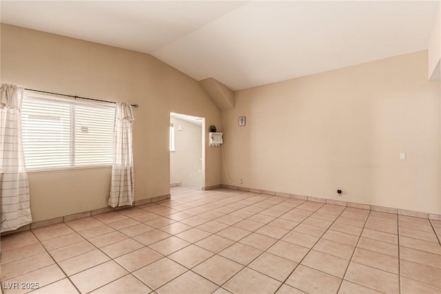 8041 Astrology Ct Unit 201, Las Vegas, NV 89128 - empty room featuring vaulted ceiling and light tile patterned floors