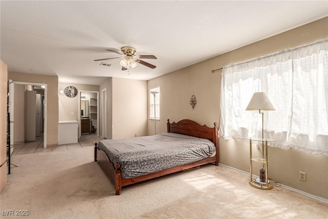 8041 Astrology Ct Unit 201, Las Vegas, NV 89128 - bedroom featuring light carpet, a ceiling fan, and ensuite bath