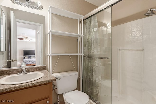 8041 Astrology Ct Unit 201, Las Vegas, NV 89128 - bathroom featuring a stall shower, vanity, a ceiling fan, and ensuite bathroom