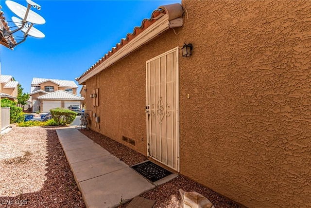 8041 Astrology Ct Unit 201, Las Vegas, NV 89128 - view of exterior entry featuring stucco siding and crawl space