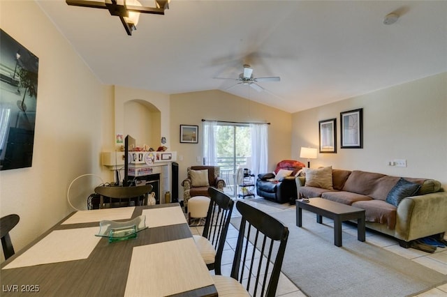 5415 W Harmon Ave Unit 2075, Las Vegas, NV 89103 - dining room with a ceiling fan, light tile patterned flooring, lofted ceiling, and arched walkways
