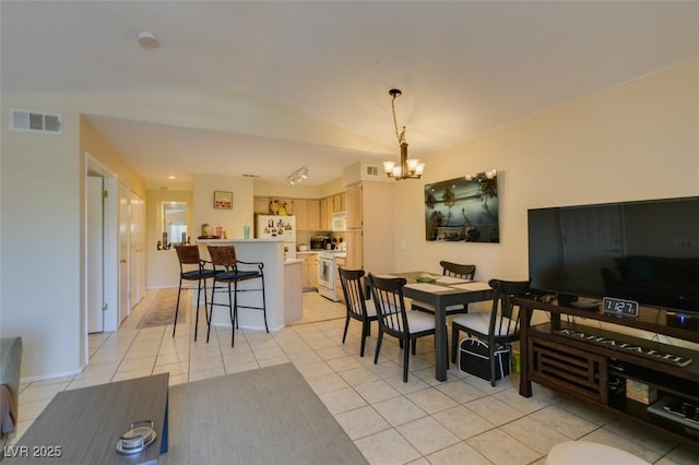 5415 W Harmon Ave Unit 2075, Las Vegas, NV 89103 - dining room featuring a chandelier and light tile patterned floors