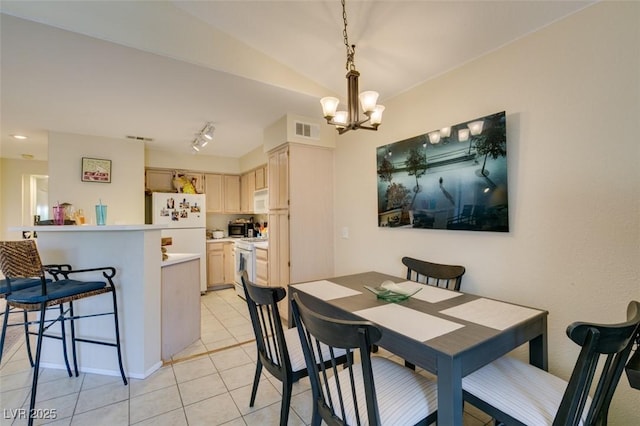 5415 W Harmon Ave Unit 2075, Las Vegas, NV 89103 - dining area featuring light tile patterned floors and a chandelier