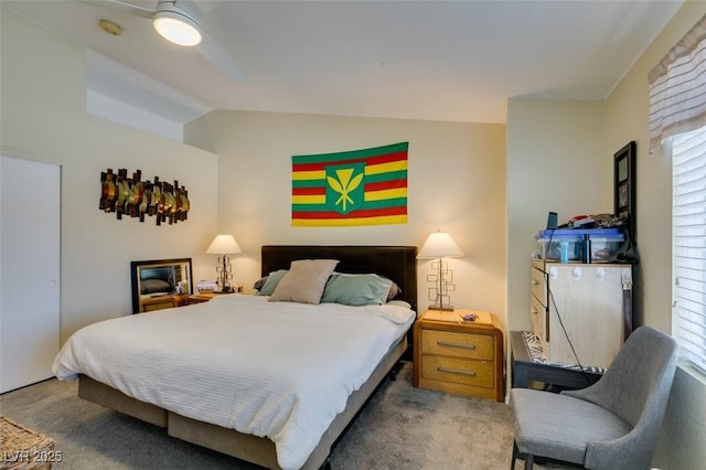 5415 W Harmon Ave Unit 2075, Las Vegas, NV 89103 - carpeted bedroom with multiple windows, vaulted ceiling, and a ceiling fan
