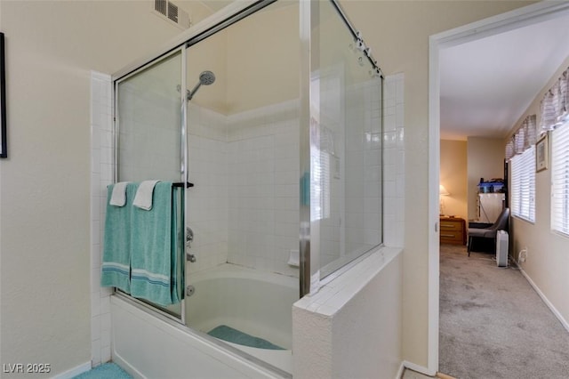 5415 W Harmon Ave Unit 2075, Las Vegas, NV 89103 - ensuite bathroom featuring enclosed tub / shower combo and baseboards
