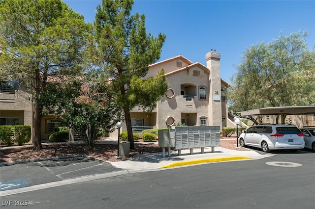 5415 W Harmon Ave Unit 2075, Las Vegas, NV 89103 - view of building exterior featuring covered and uncovered parking