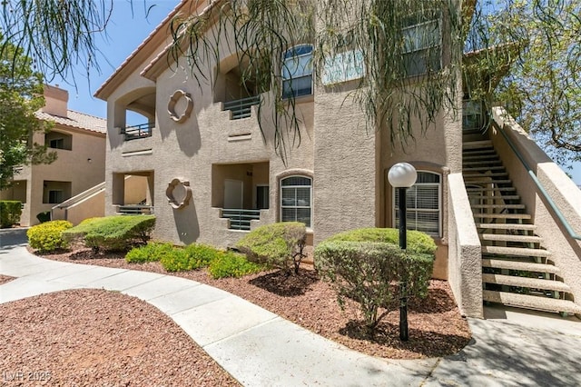 5415 W Harmon Ave Unit 2075, Las Vegas, NV 89103 - view of property with stairway