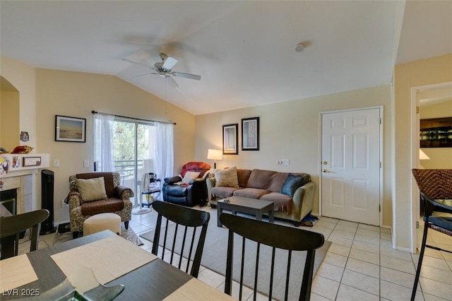 5415 W Harmon Ave Unit 2075, Las Vegas, NV 89103 - living area with ceiling fan, lofted ceiling, light tile patterned floors, and arched walkways