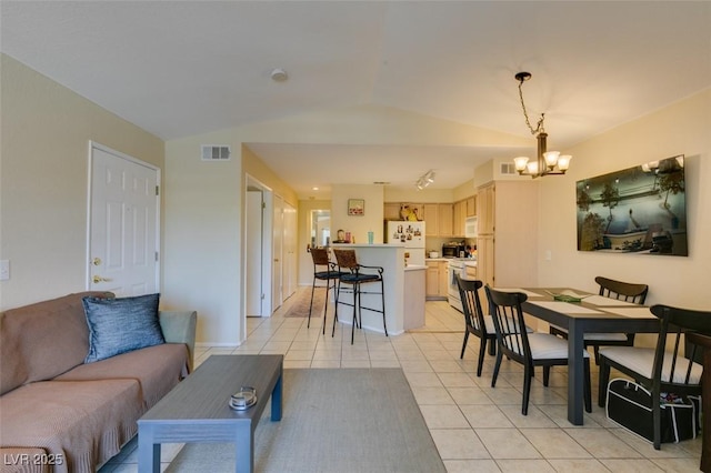 5415 W Harmon Ave Unit 2075, Las Vegas, NV 89103 - living room featuring lofted ceiling, a chandelier, and light tile patterned floors