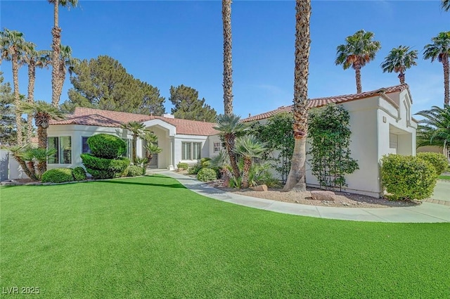 5224 Painted Lakes Way, Las Vegas, NV 89149 - mediterranean / spanish home featuring a front lawn, stucco siding, and a tile roof
