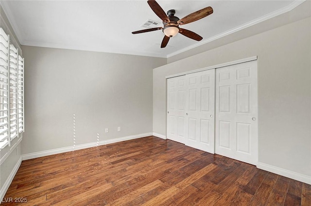 5224 Painted Lakes Way, Las Vegas, NV 89149 - unfurnished bedroom featuring wood finished floors, crown molding, a closet, and a ceiling fan