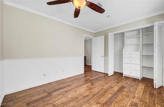 5224 Painted Lakes Way, Las Vegas, NV 89149 - unfurnished bedroom with wood finished floors, ornamental molding, ceiling fan, and a closet