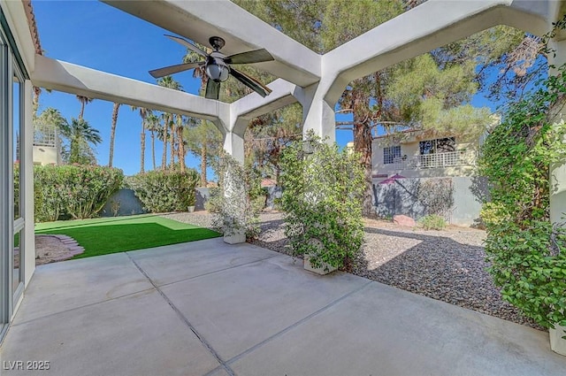 5224 Painted Lakes Way, Las Vegas, NV 89149 - fenced backyard featuring a ceiling fan and a patio area