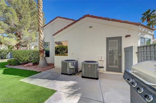 5224 Painted Lakes Way, Las Vegas, NV 89149 - back of property with a patio, stucco siding, and a yard