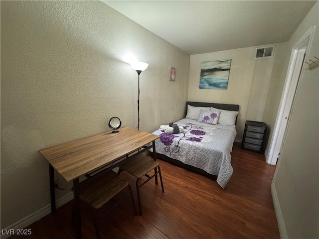 5499 Indian River Dr Unit 356, Las Vegas, NV 89103 - bedroom with wood finished floors and a textured wall