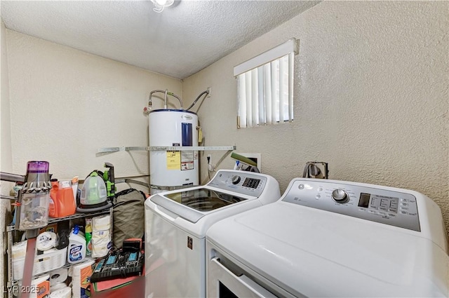 744 Mcknight St, Las Vegas, NV 89101 - washroom with strapped water heater, washer and dryer, a textured wall, and a textured ceiling