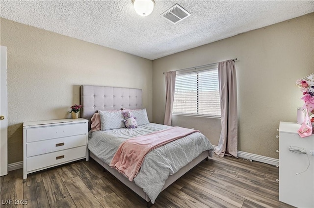 744 Mcknight St, Las Vegas, NV 89101 - bedroom with wood finished floors and a textured ceiling