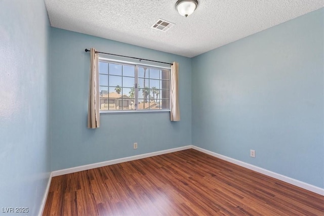 1711 Ember Glow Cir, Las Vegas, NV 89119 - spare room with wood finished floors and a textured ceiling