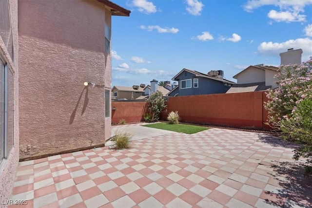 1711 Ember Glow Cir, Las Vegas, NV 89119 - fenced backyard with a residential view and a patio