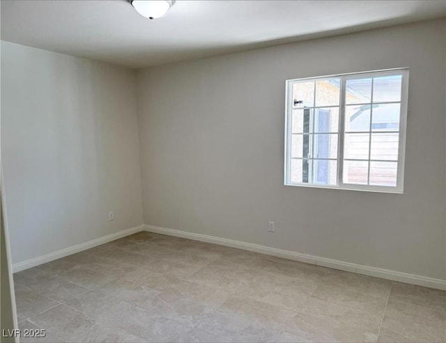 236 Pershing Dr, Las Vegas, NV 89107 - unfurnished room with baseboards and light tile patterned floors